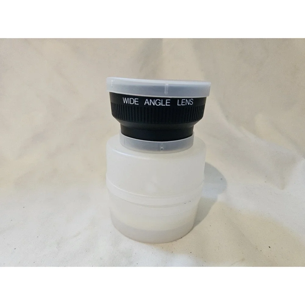 Wide angle lens made in Japan,‎ listed with Both Lens caps